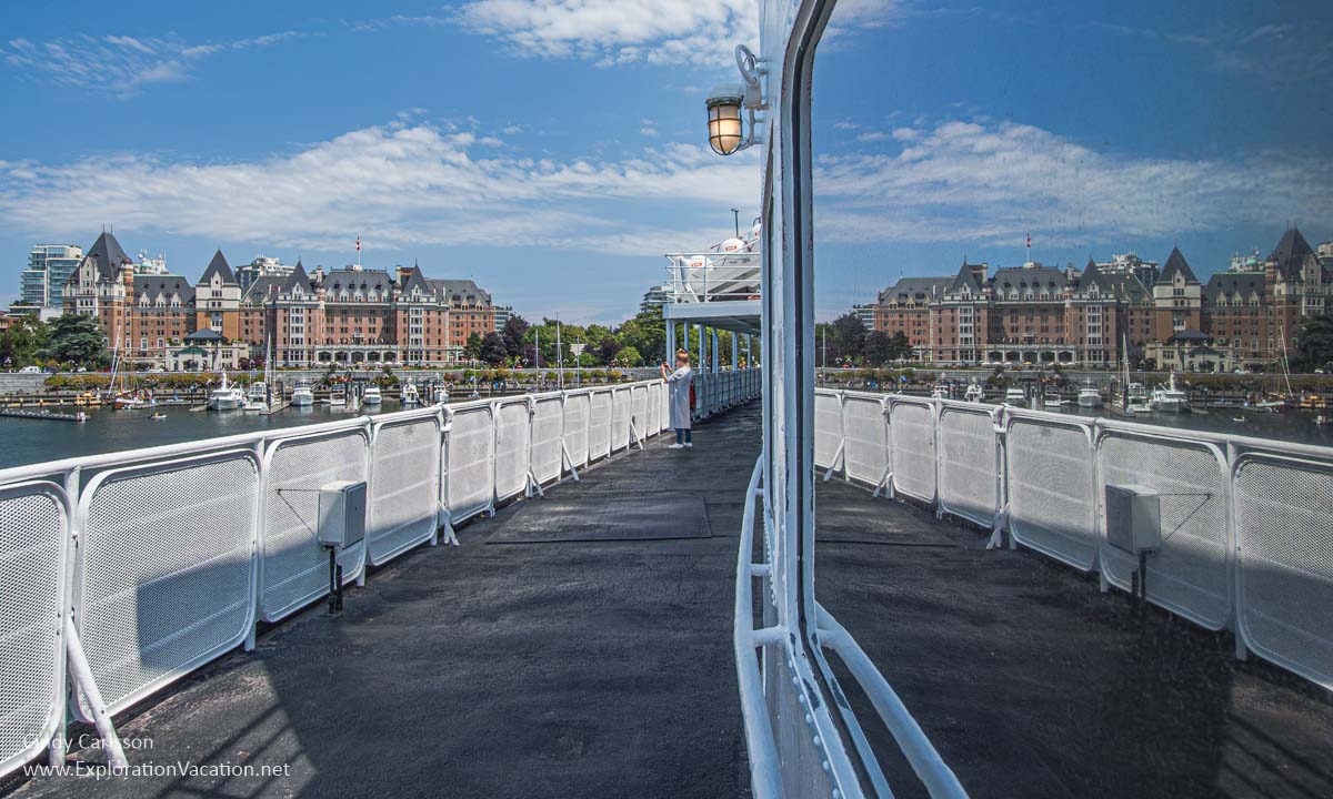 The Victoria waterfront as seen beyond the deck of a ferry.