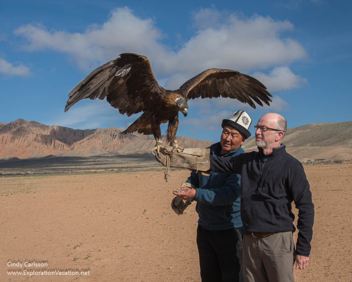 Photo of men with a golden eagle.