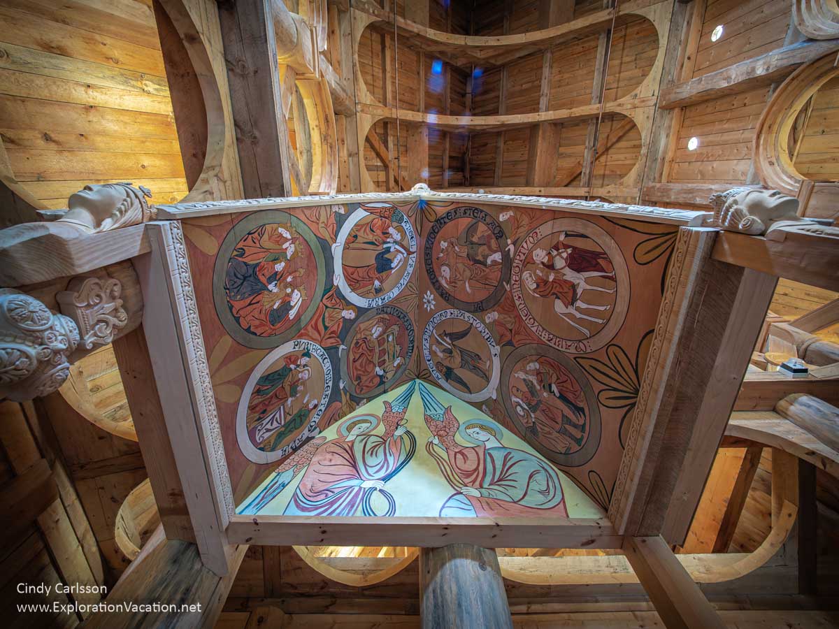 Colorful painted interior of a wooden canopy in a church.