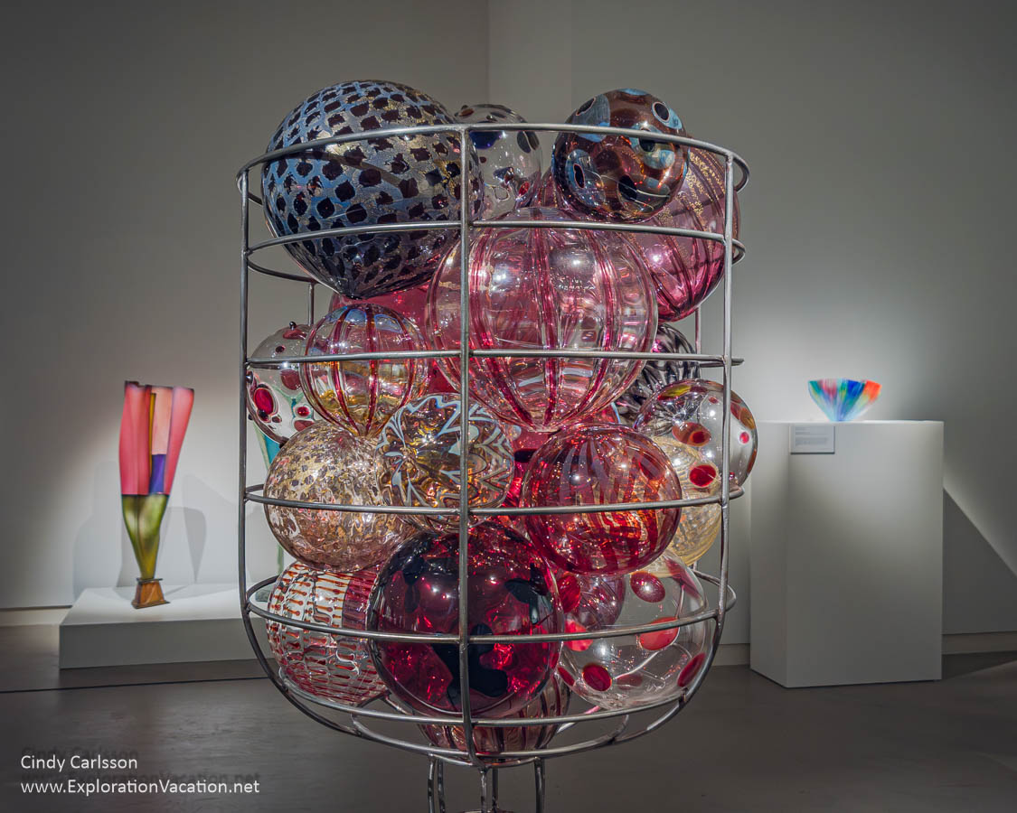 A huge metal frame filled with glass balls by American Ginny Ruffner in 2024.