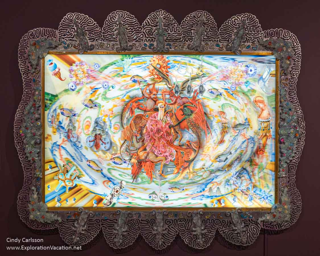 Photo of an old man attacked by demons in the lenticular print Miss Mito by Einar and Jamex de la Torre at the Cafesjian Art Trust in Minnesota. (Photo © Cindy Carlsson on ExplorationVacation.net)
