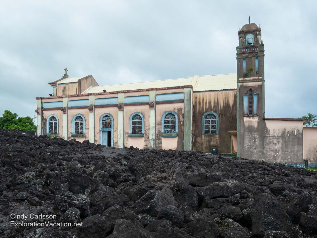 An old Catholic church surrounded by hardened lava.