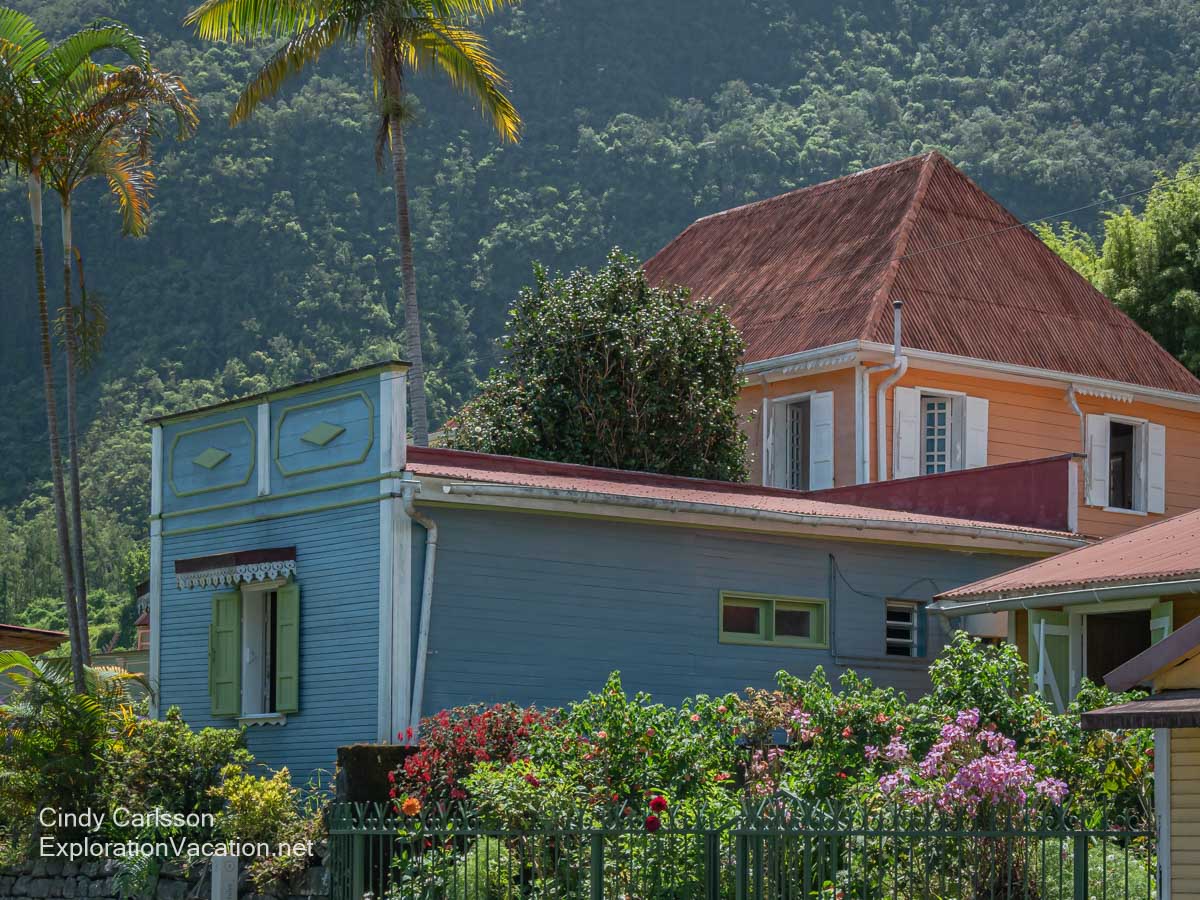 Colorful wooden Creole buildings and flowers.