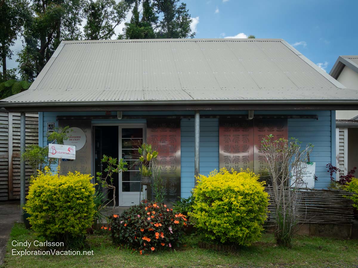 A historic wood cottage with a metal roof.