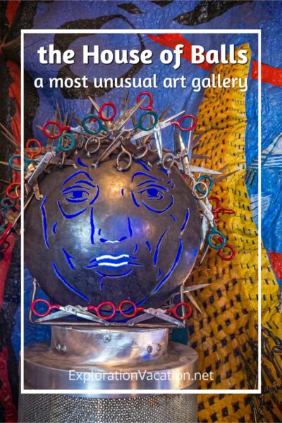 A head made out of scrap material, including scissors with text "The House of Balls: A most unusual art gallery - ExplorationVacation.net."