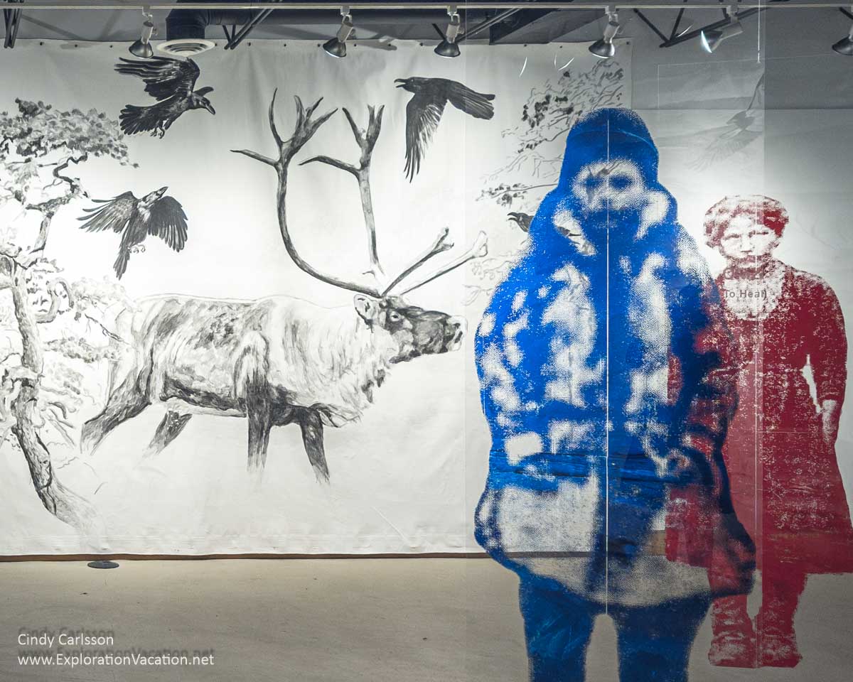 Transparent images of a man and a woman in front of a drawing of caribou in Arctic Scandinavia.